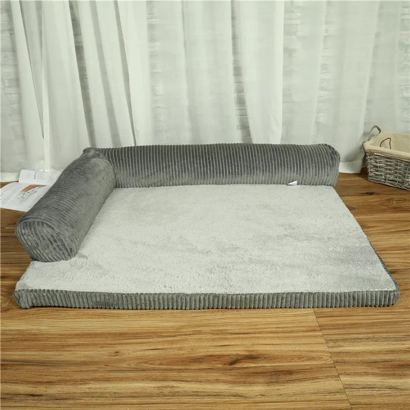 Corduroy fabric pet sofa dog bed in a grey colour, showing raised sides and plush high-density sponge padding.
