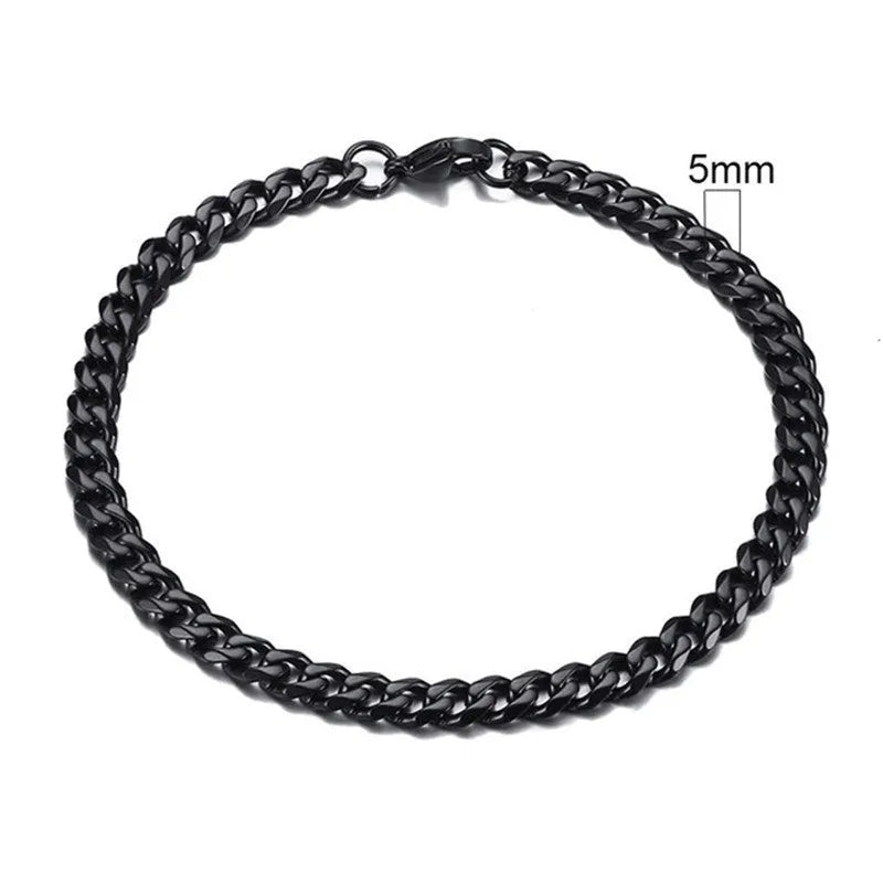 Six-sided geometric link metal bracelet in gold colour on a wrist.