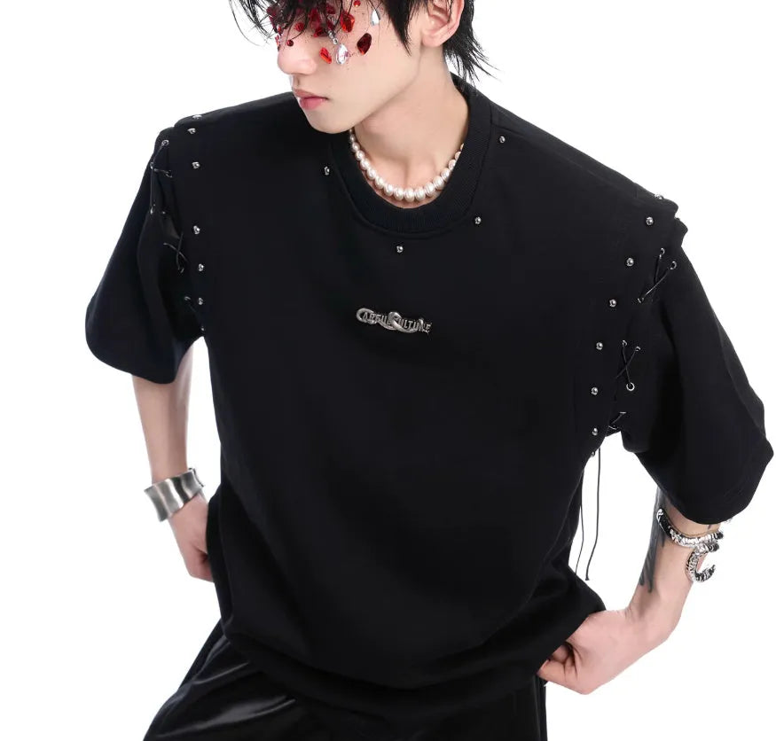 Women's short sleeve top with side lace-up detail and geometric cutouts in black colour