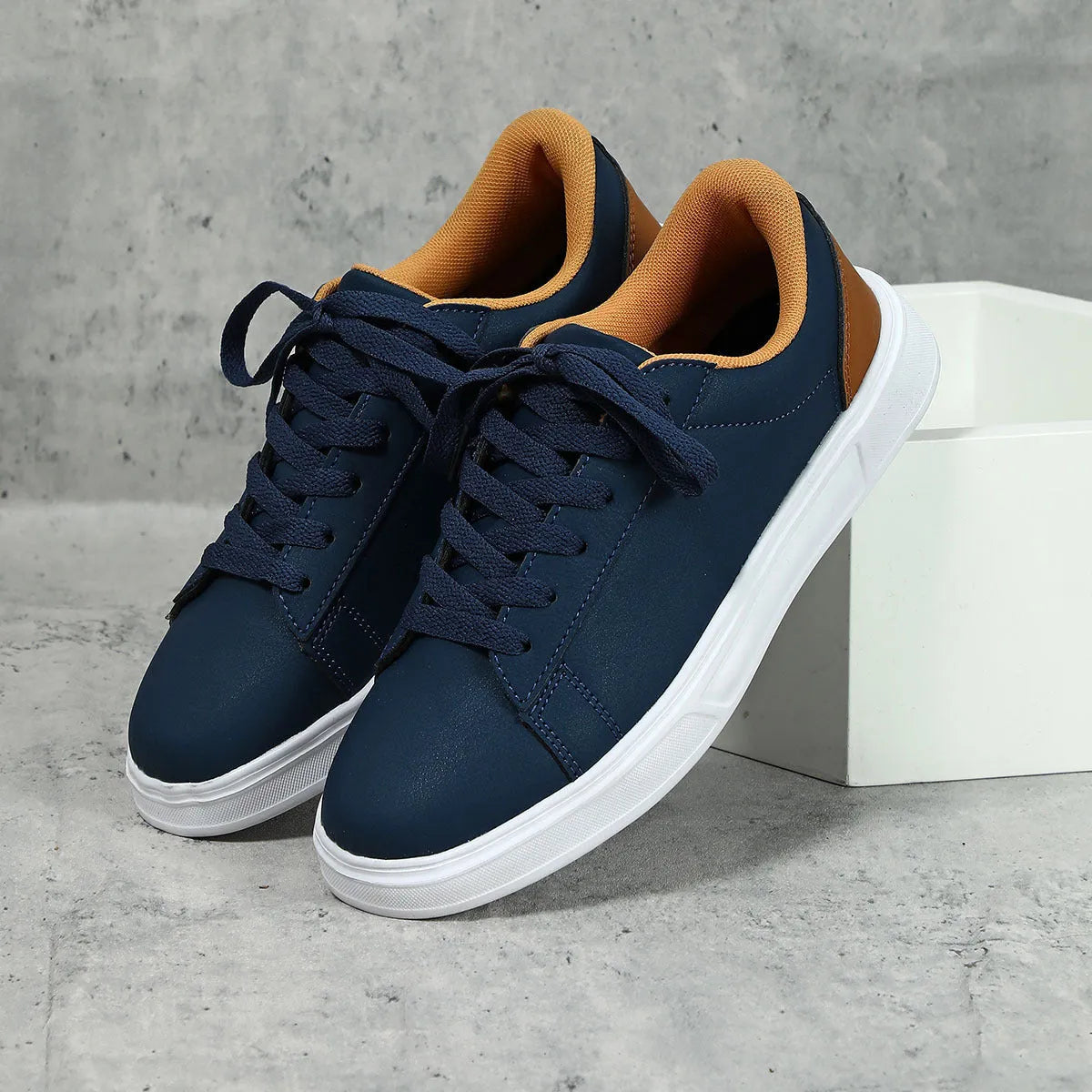 Low-top platform skate shoes with cross-strap detail and mid-heel design in beige brown colour