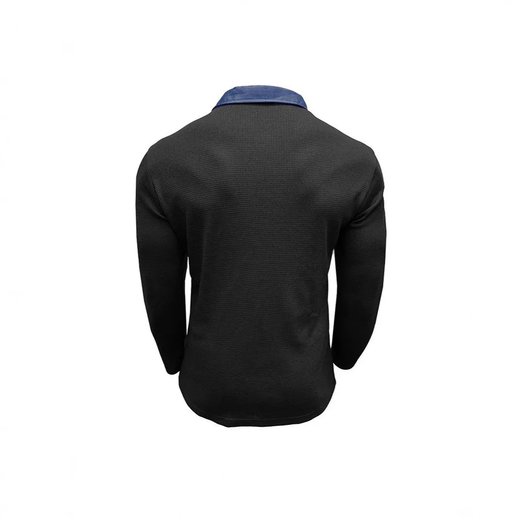 Man wearing a long-sleeved waffle texture polo shirt in a loose fit, showcasing the asymmetric detail.