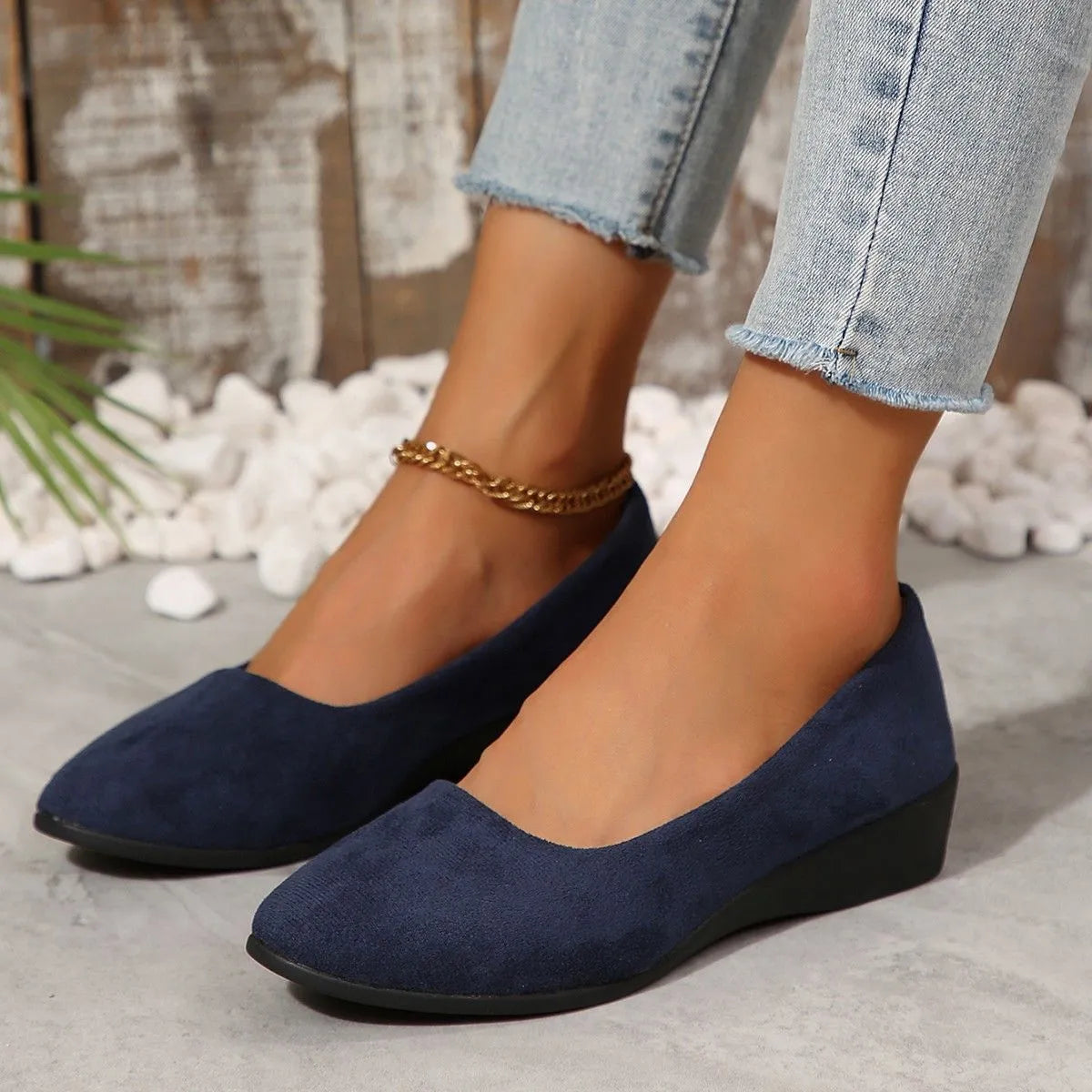 Women's pointed toe wedge pumps with suede upper and shallow mouth cut in light brown