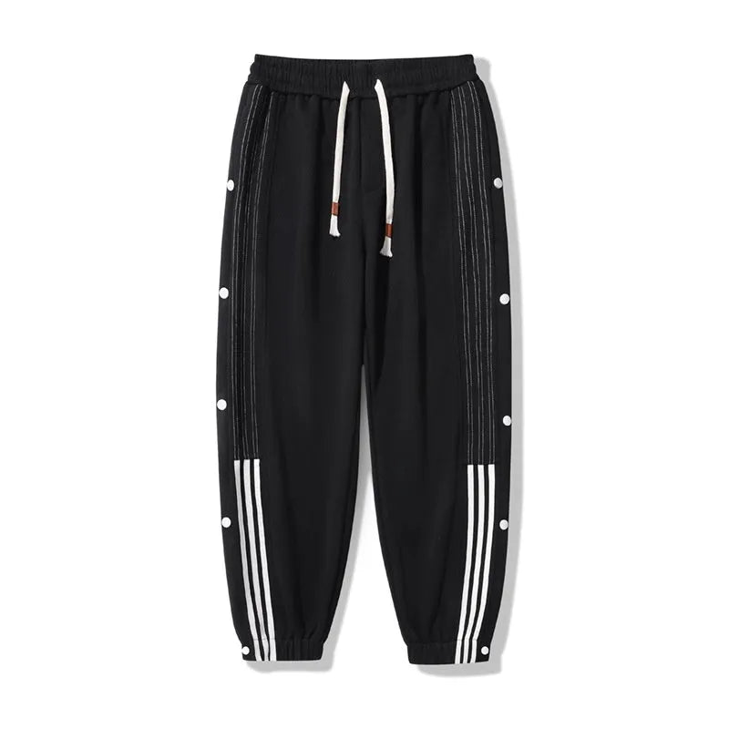 Men's loose fit cotton blend sports pants with high waist and ankle-tied cuffs in solid colours