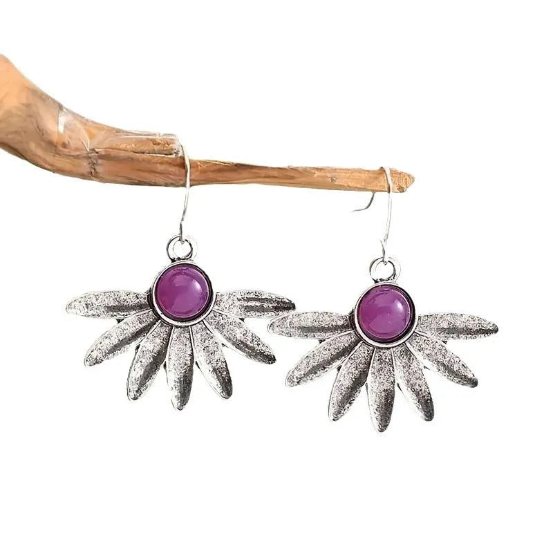 Purple Bohemian style floral earrings with resin gemstone details and zodiac animal modelling in alloy metal