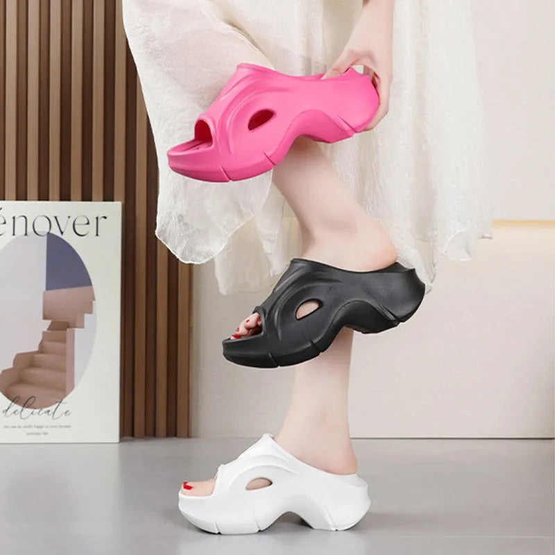 Women's thick-soled EVA slippers in rose red colour showing round toe design