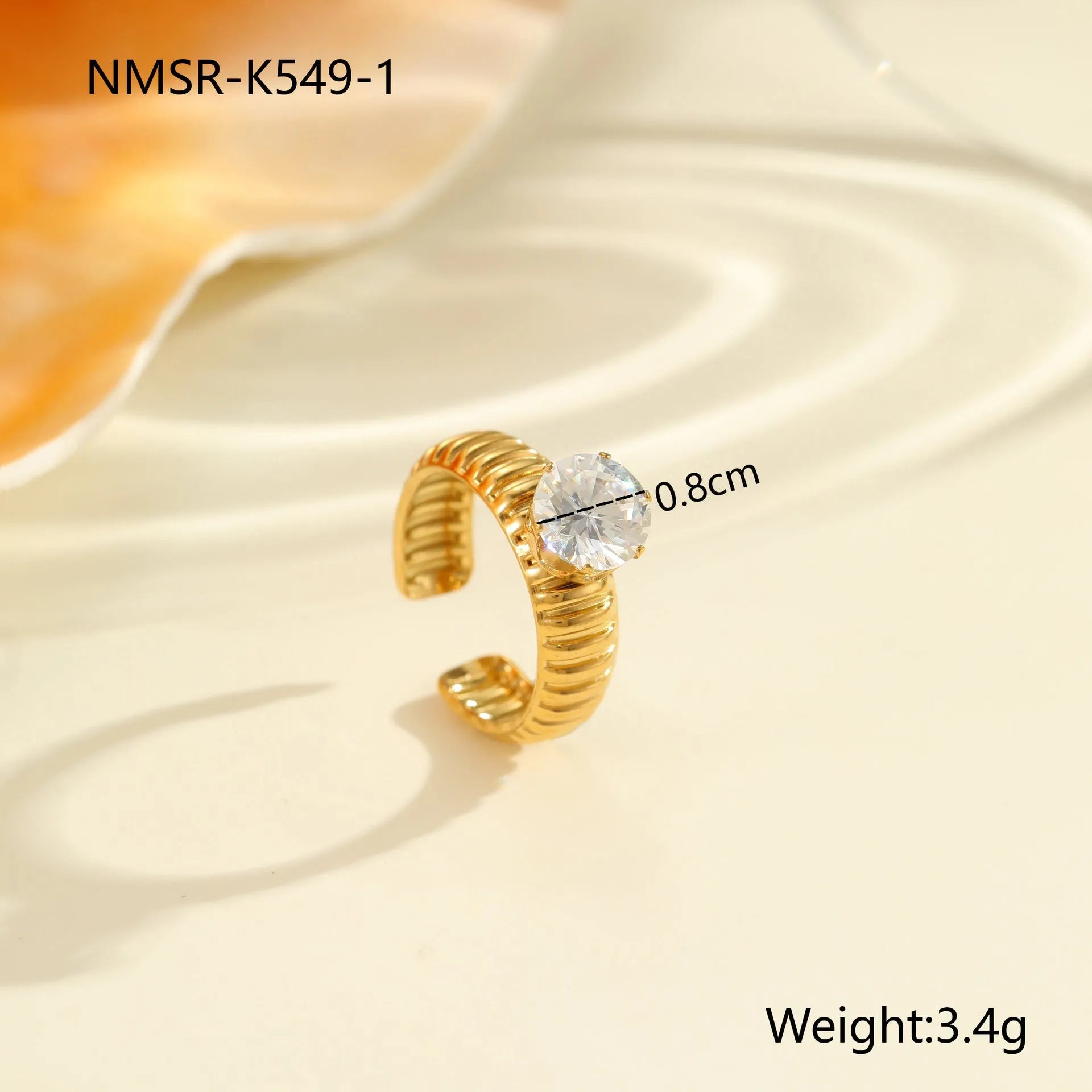 Gold electroplated stainless steel ring with zircon geometric design and open mouth adjustable fit