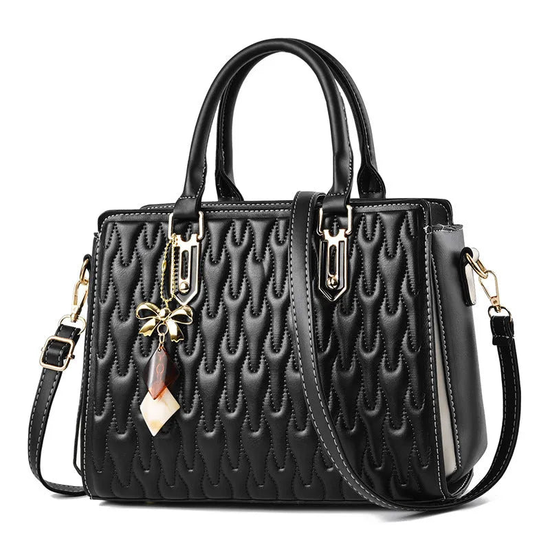 Women's large-capacity polyester messenger bag in black, showing pocket sandwich organisation