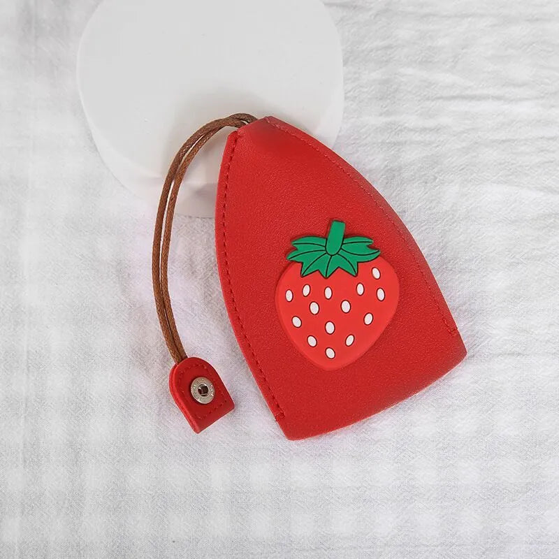 Cartoon pull-out car key case in PU leather with colourful designs measuring 14 x 7.5 cm