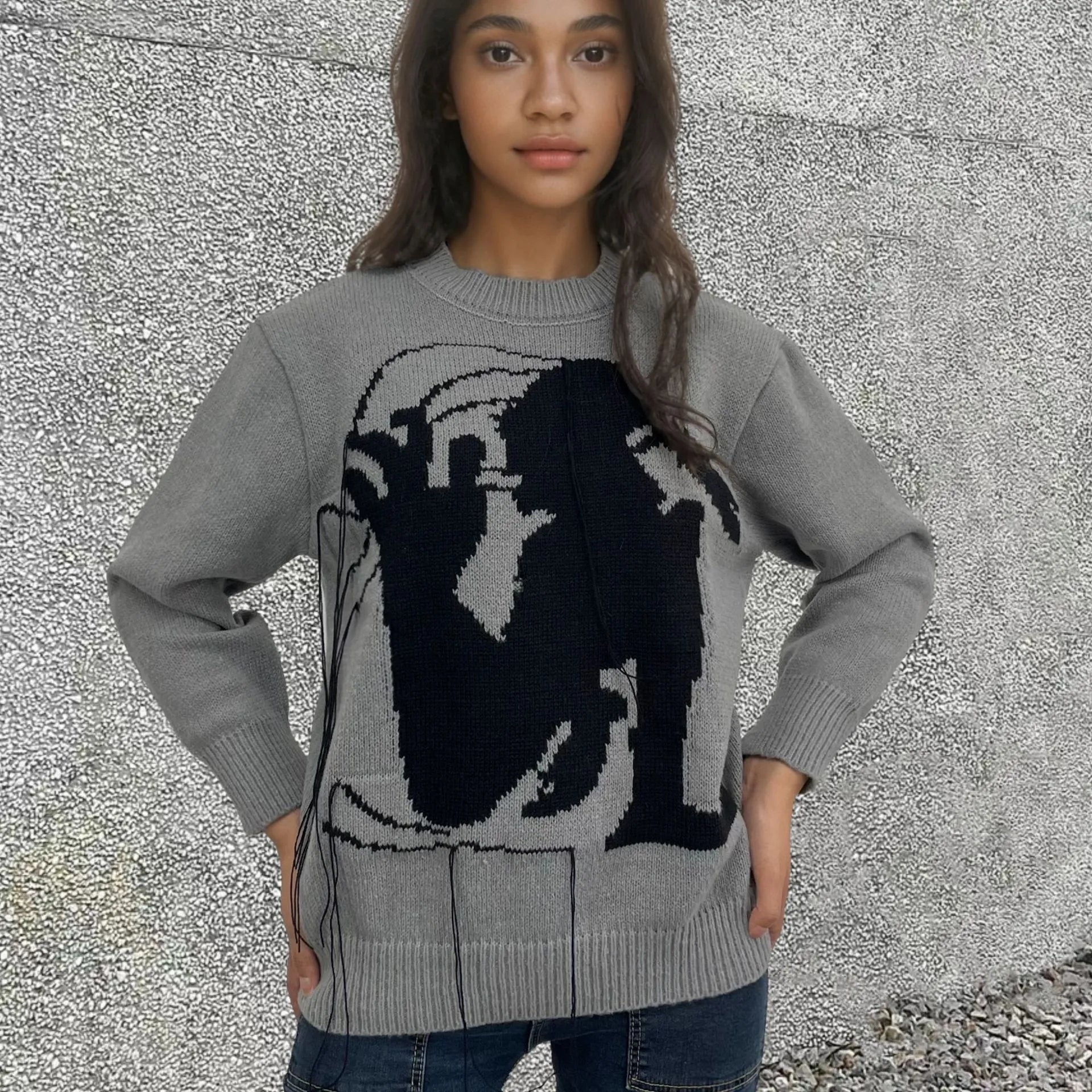 Women's grey alpaca wool sweater with tassel design and abstract pattern