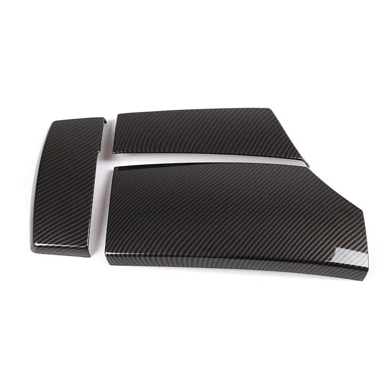 Three ABS armrest box protective covers with carbon fibre diagonal weave pattern showing polished shiny surface