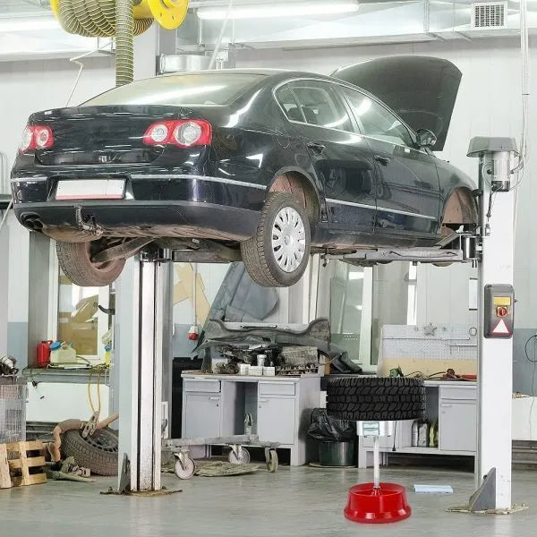 Portable aluminium hub tyre balancer with bull's eye level on enamel base.