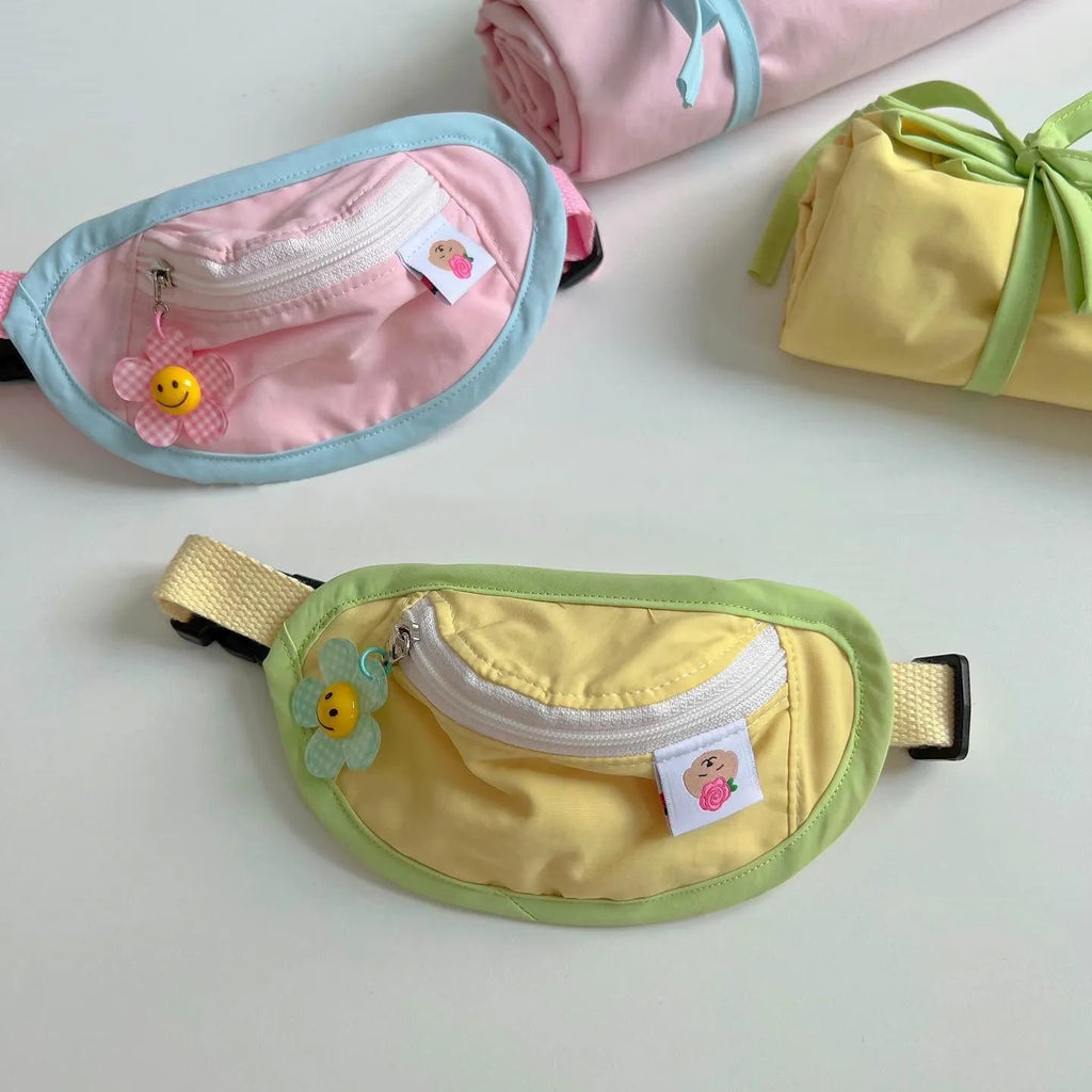 Pet backpack for dogs and cats in powder blue, yellow, and green colours with measured sizing