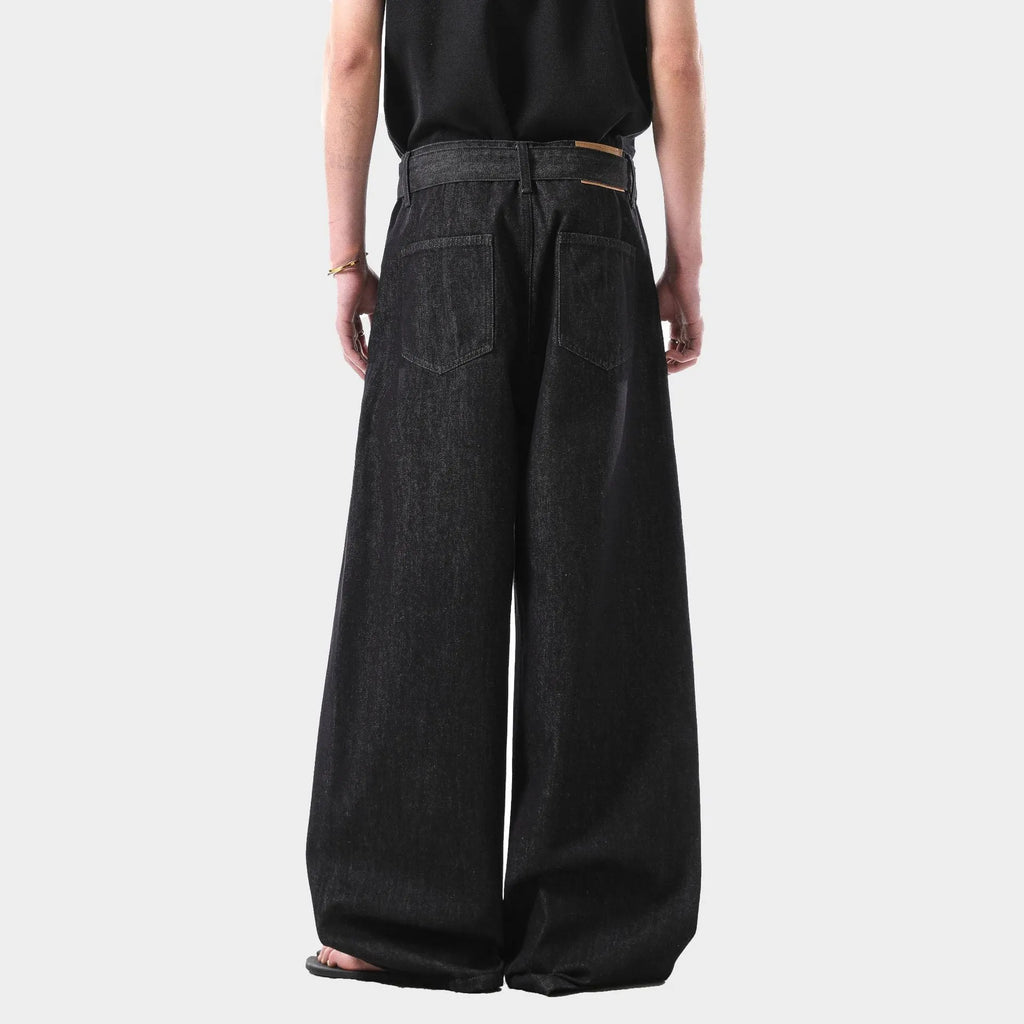 Black high-waist straight-leg denim jeans on a neutral background.