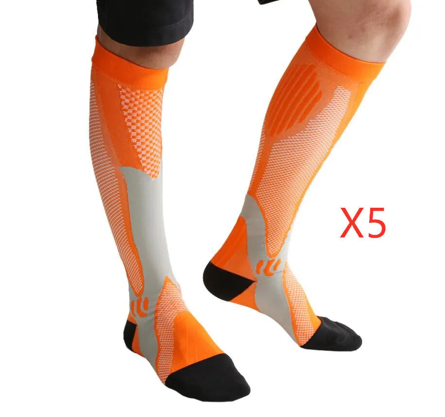 Athletic fit graduated compression socks for men and women in black, shown on a leg.