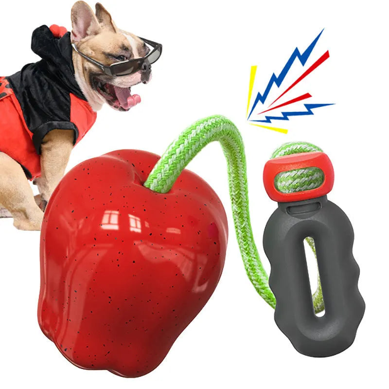 Plastic dog dental toy with dropping ball design for molar cleaning in green and red colours