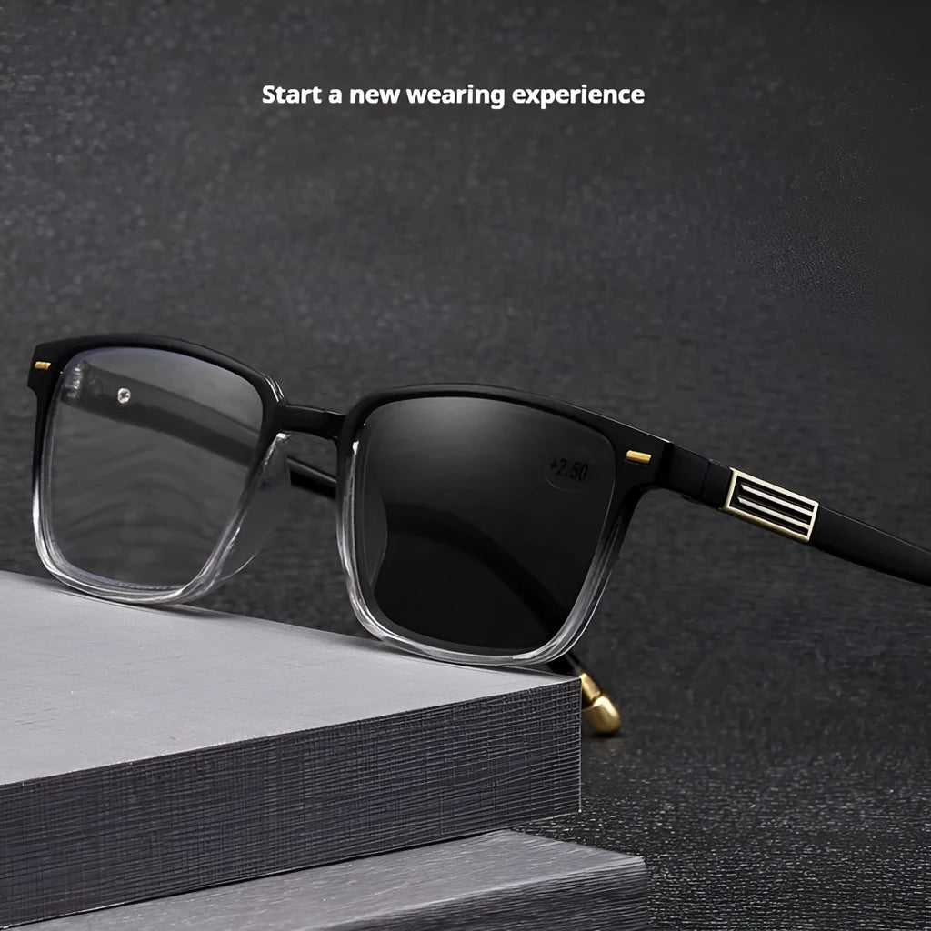 Multifocal reading glasses with colour changing, anti-blue light PC lenses in a black and silver frame style.