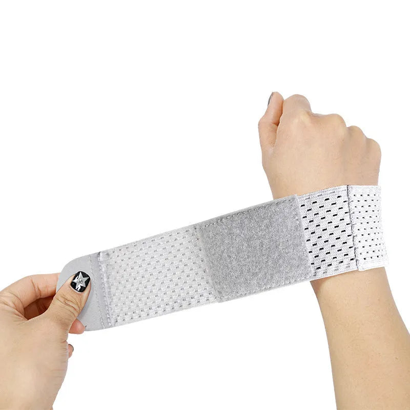 Elasticated athletic wristguard in black, grey or pink colour with breathable construction