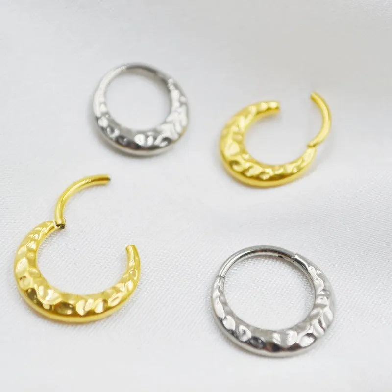 ASTM F136 titanium alloy nose ring with concave-convex carved design in gold or silver.