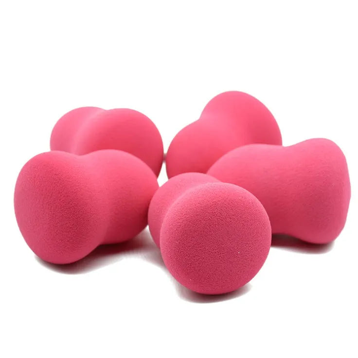 Pink hydrophilic non-latex makeup foundation sponge on a white background.