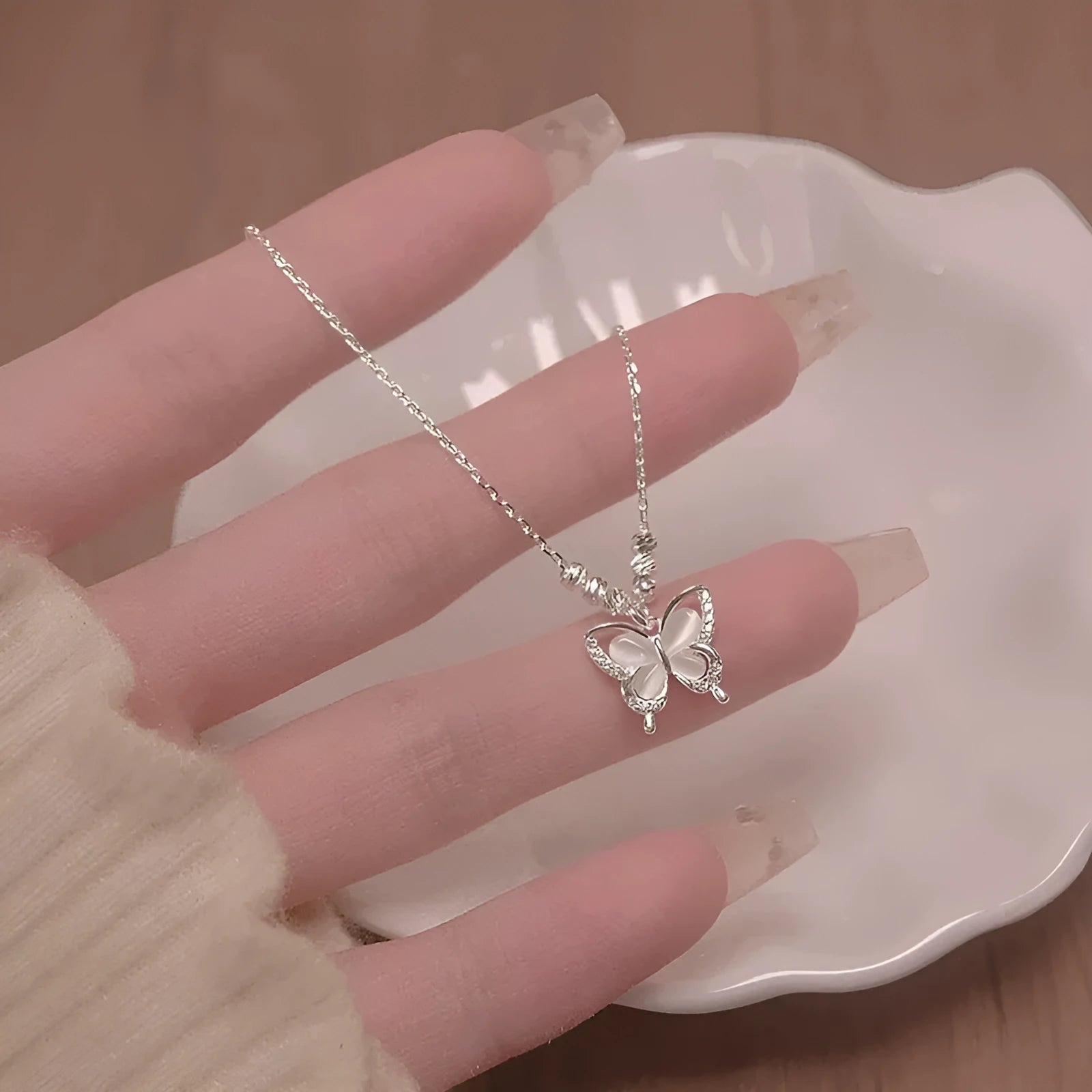 Women's 925 silver butterfly necklace with square opal pendant on cross chain showing 41-50cm length