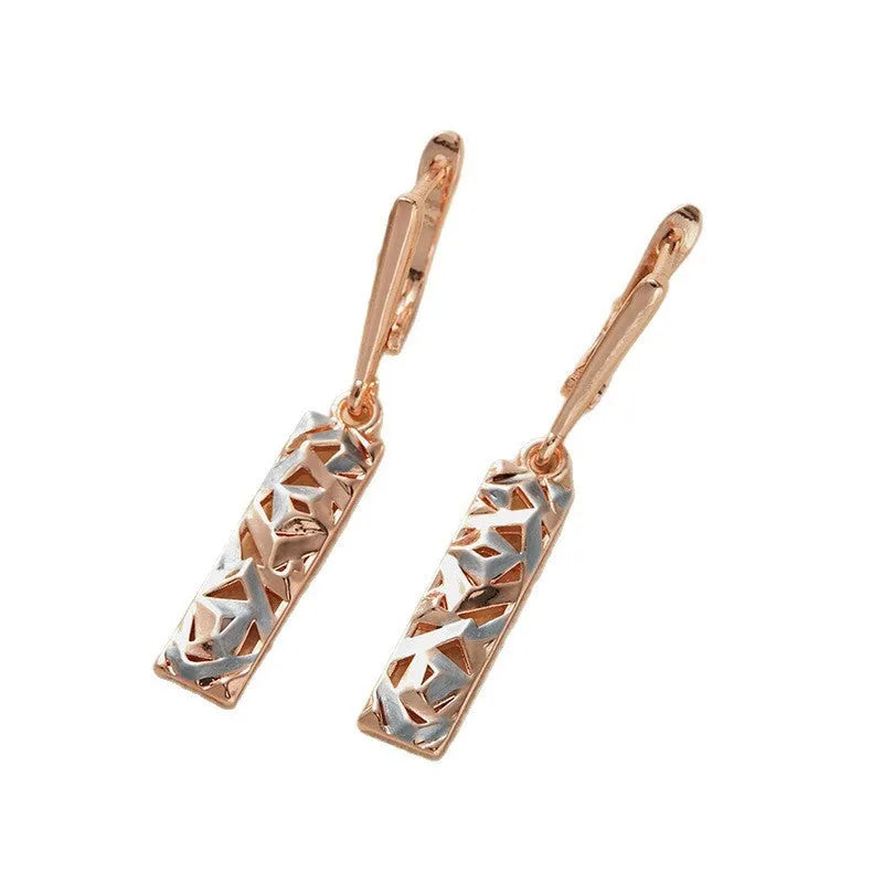 Rectangular two-tone hollow stud earrings with geometric openwork centre and electroplated finish