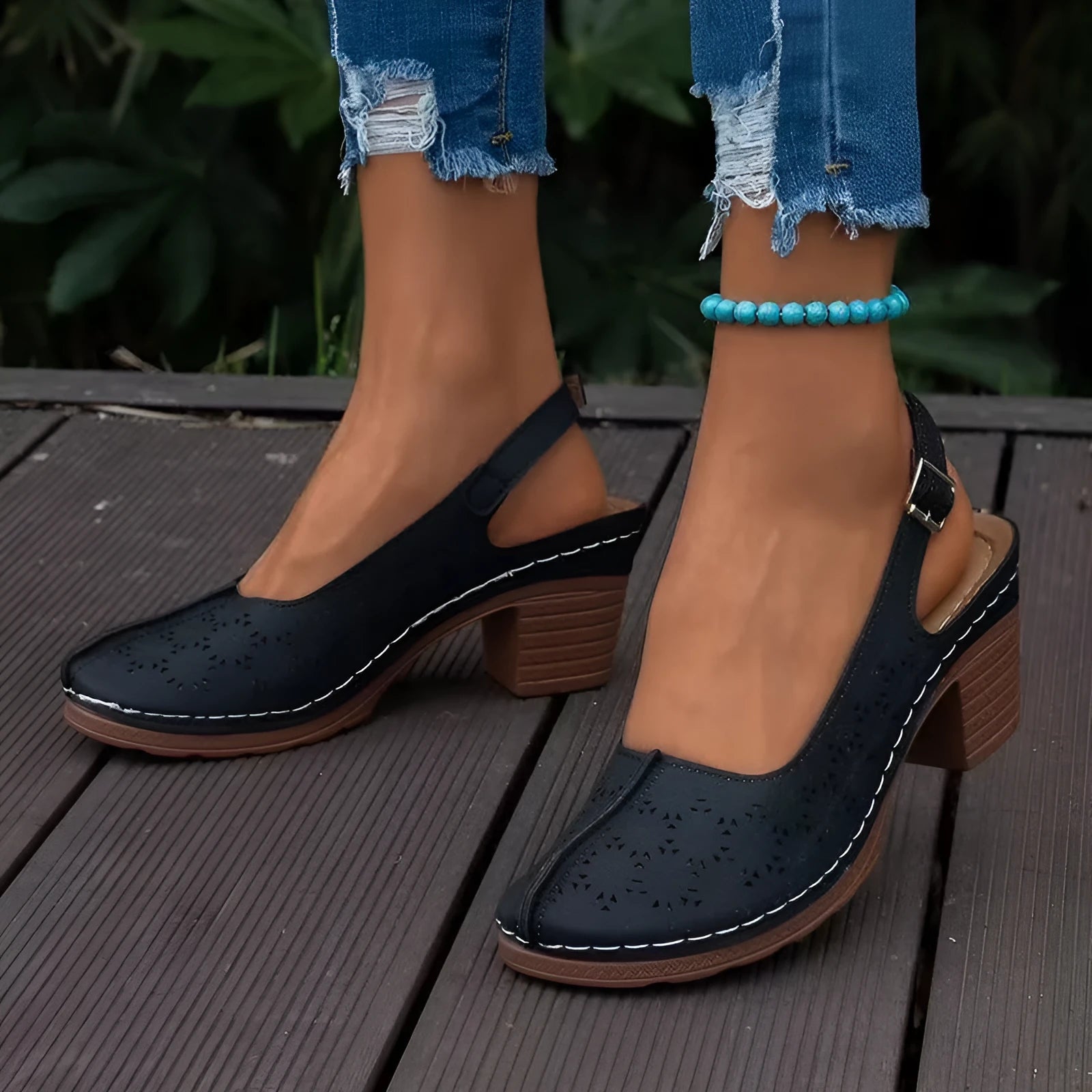 Women's closed toe wedge sandals in black with round toe design and wedge heel
