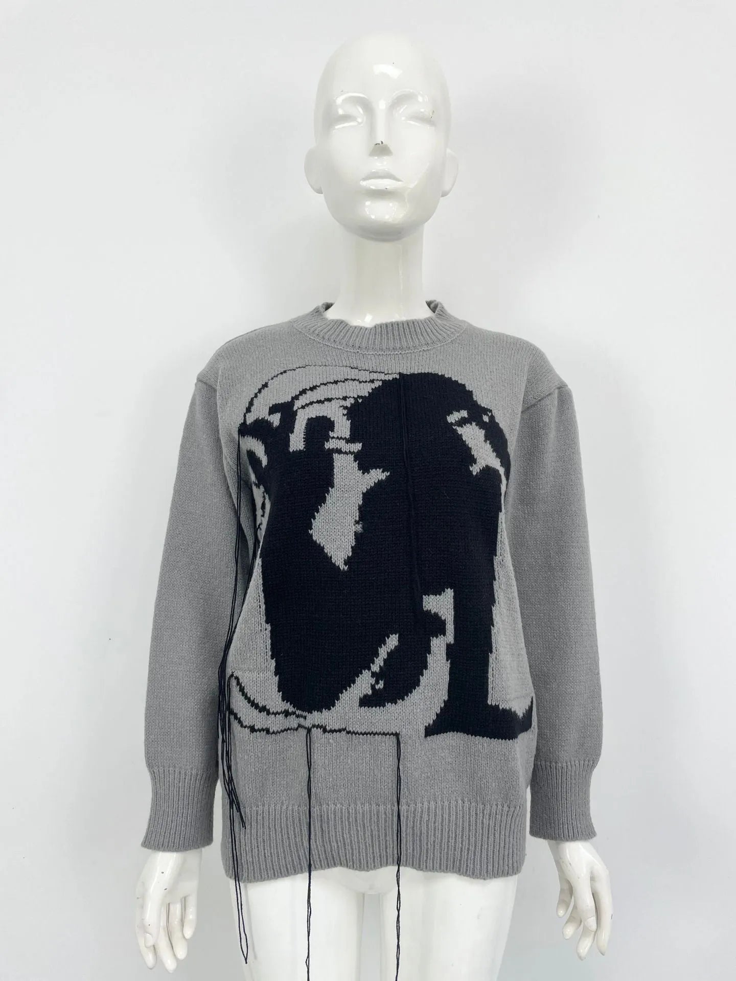 Women's grey alpaca wool sweater with tassel design and abstract pattern
