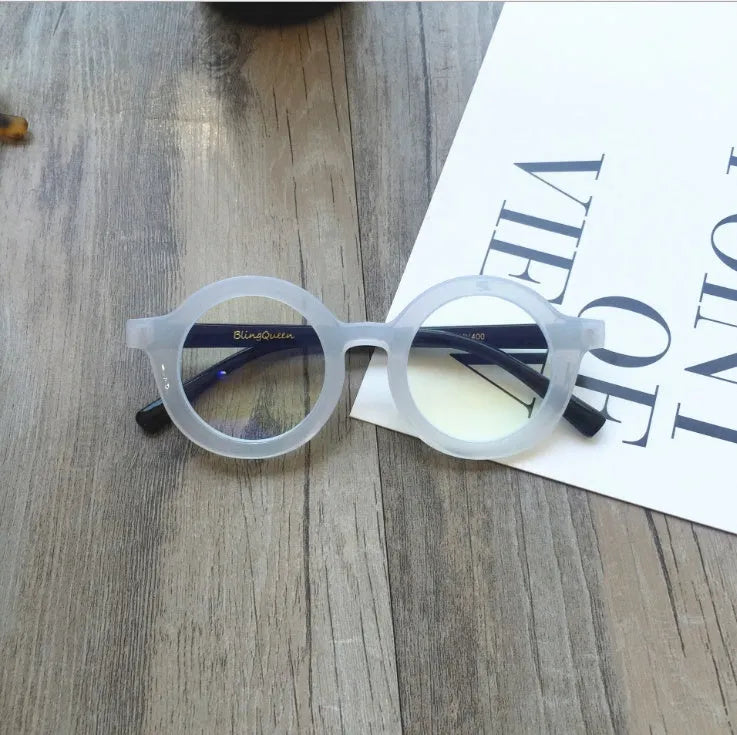 Retro round plastic frame glasses with anti-blue light filter in black, pink, leopard, red, white, or yellow.