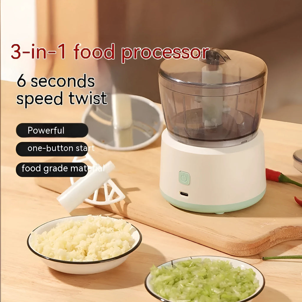 White mini electric meat grinder with transparent cup and stainless steel blade on kitchen counter
