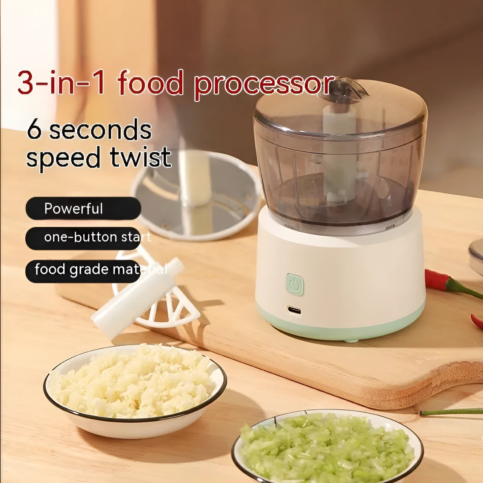 White mini electric meat grinder with transparent cup and stainless steel blade on kitchen counter