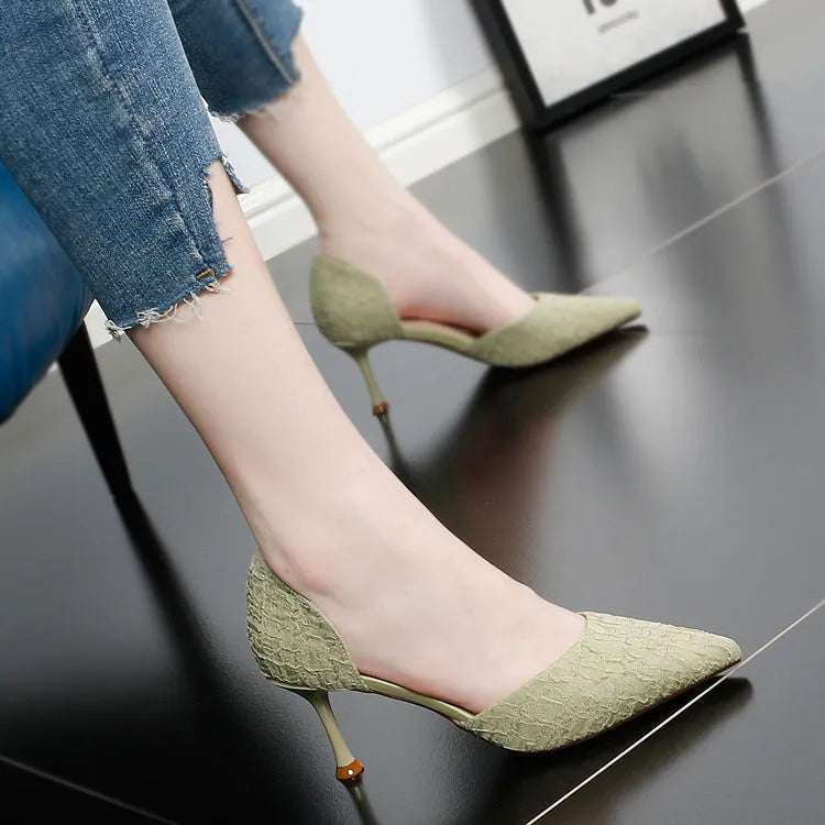 Women's pointed toe stiletto heels with sheepskin and cowhide stitching detail on the upper and rubber sole.