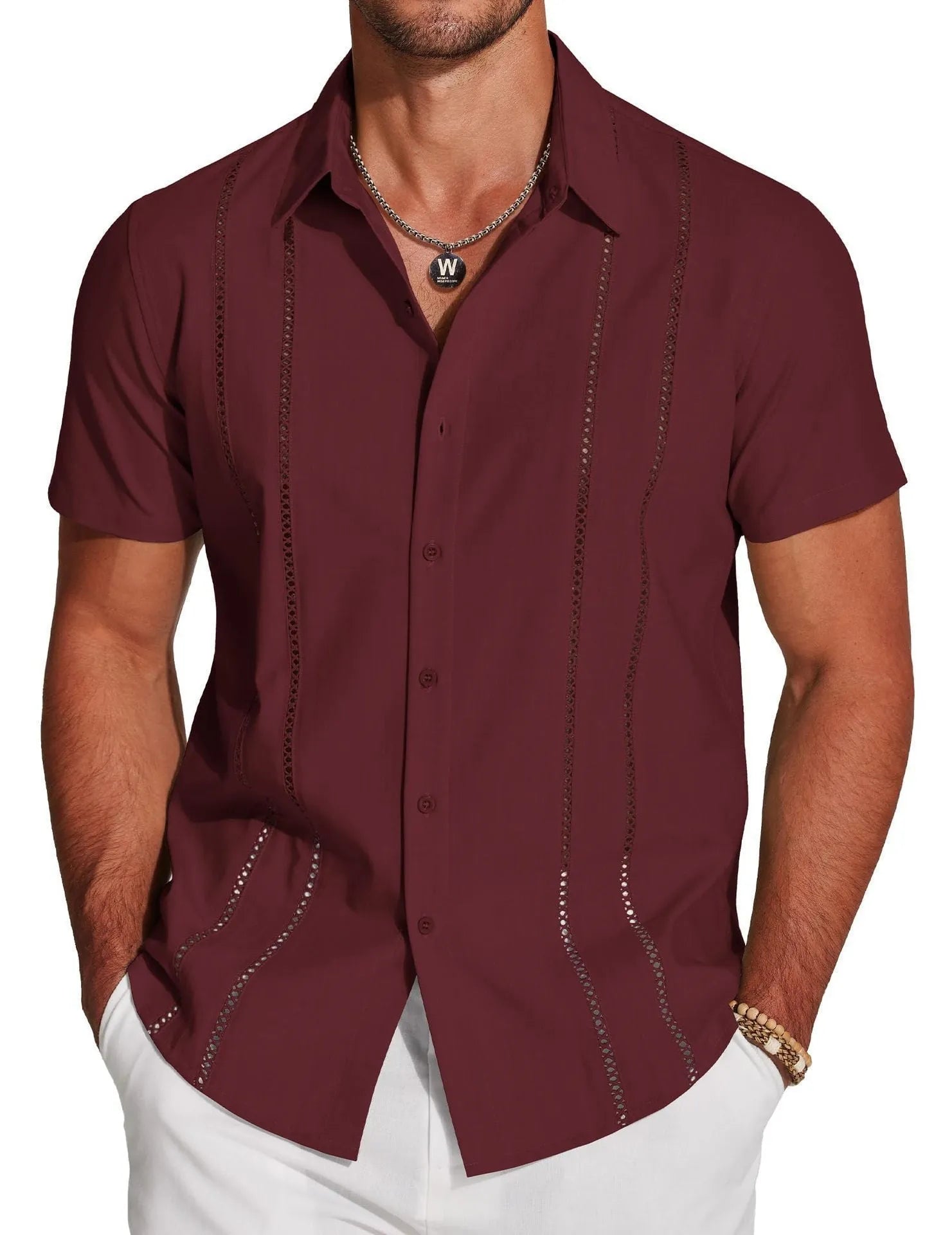 Man wearing a slim fit, short sleeve Hawaiian shirt with a colourful digital print pattern.