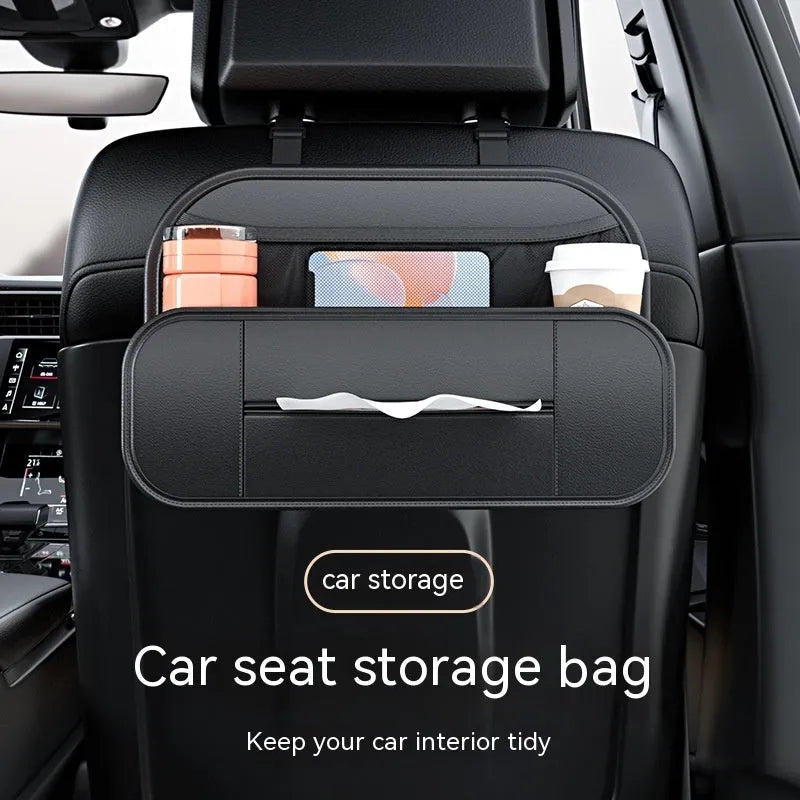 Black leather car seat rear storage bag hanging behind a vehicle seat.