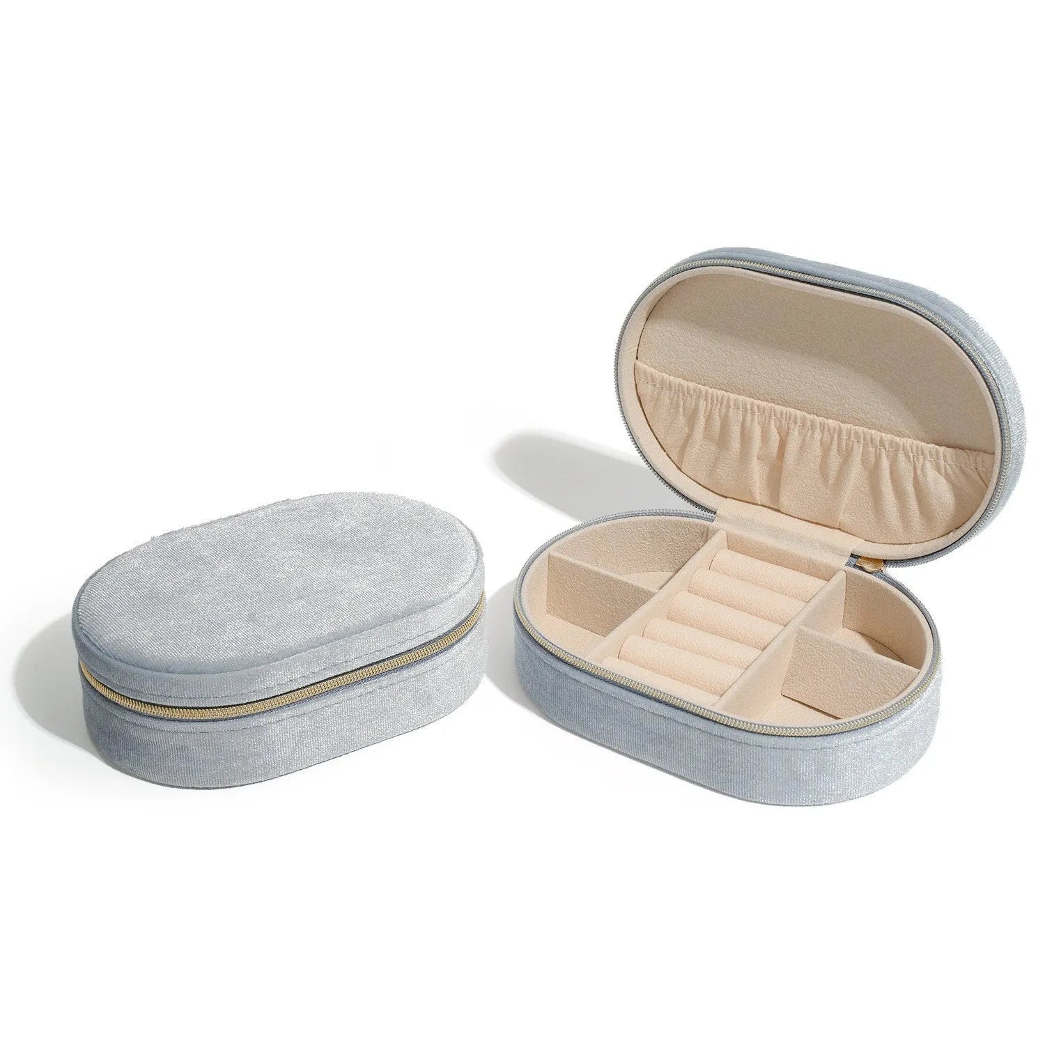 Oval velvet jewellery storage box in lake blue colour with flannel-lined interior compartments