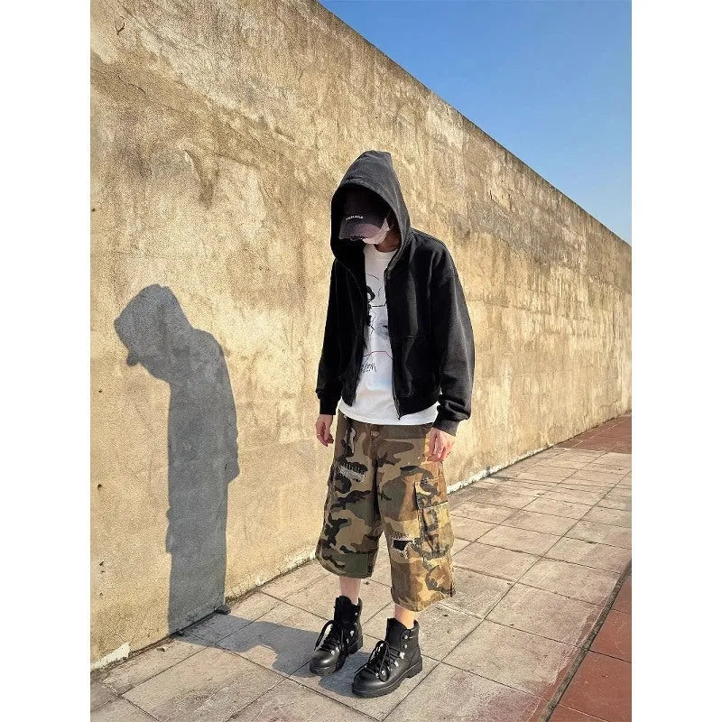 Men's camouflage pattern cropped jeans with distressed patches and straight leg cut