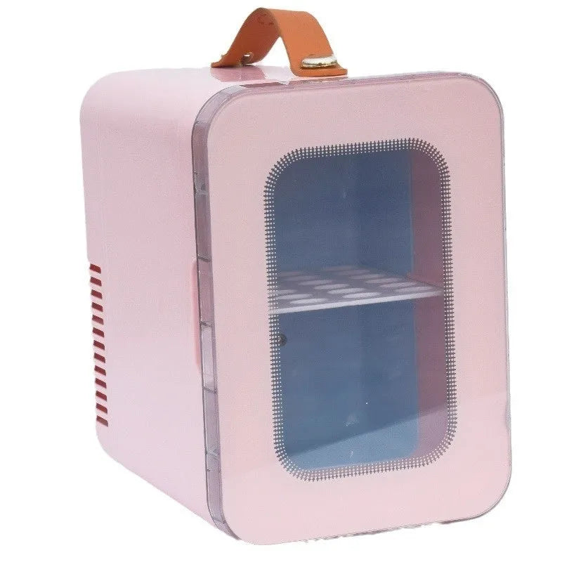 Pink mini refrigerator with transparent door showing internal storage compartments