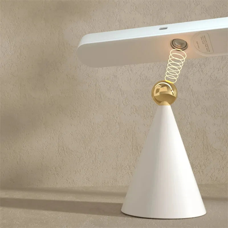 Geometric table lamp with magnetic suction base showing white and khaki colour options