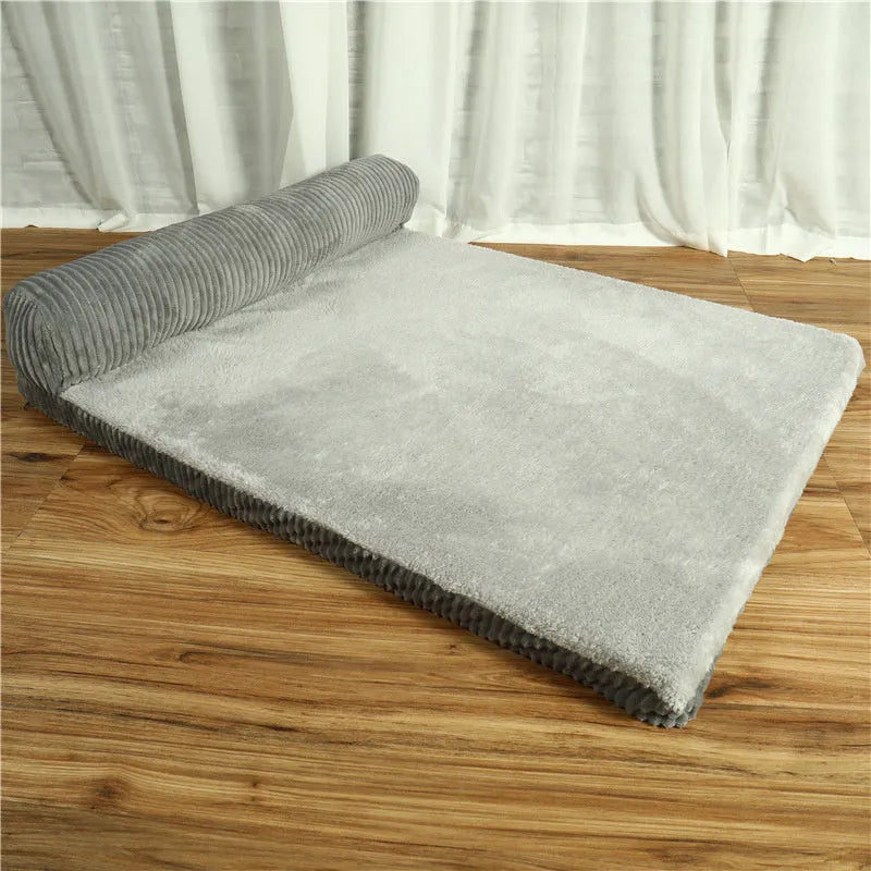 Corduroy fabric pet sofa dog bed in a grey colour, showing raised sides and plush high-density sponge padding.