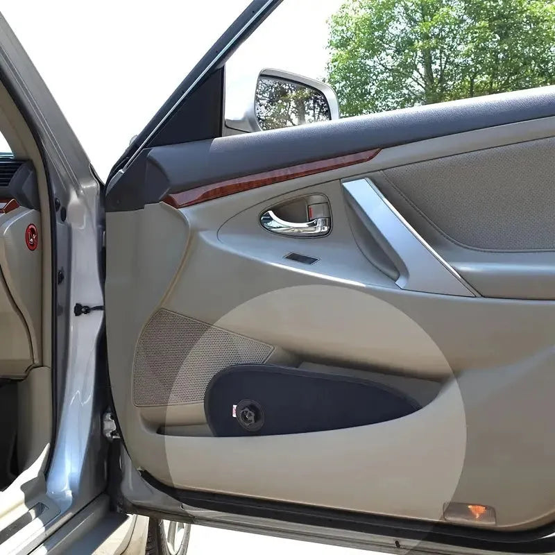 Black adjustable car side window sunshade with suction cups stretched across vehicle window