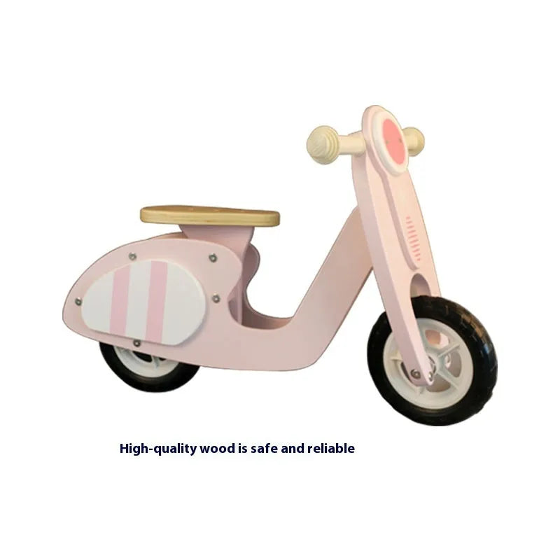 Pink wooden balance scooter for toddlers and children aged 1 to 6 years.