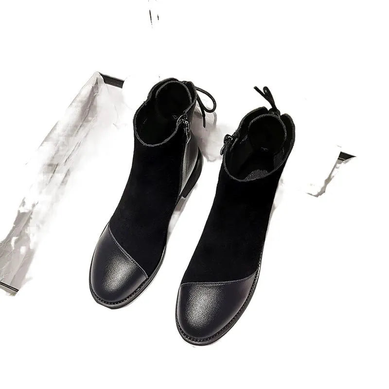 Black women's knee-high soft leather martin boots with side zip and bow detail.