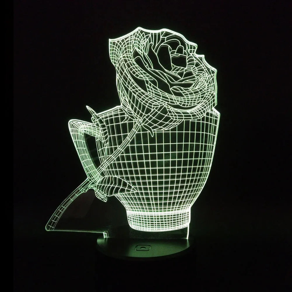 3D rose design acrylic night light with ABS base on a table, showing multi-coloured LED illumination.
