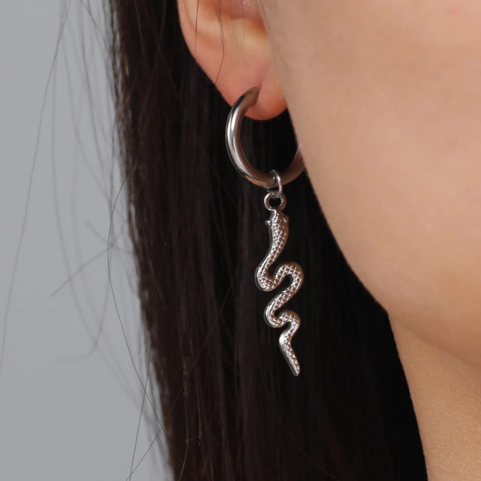 Stainless steel snake-shaped vintage clip earrings with electroplated gold finish and animal zodiac design