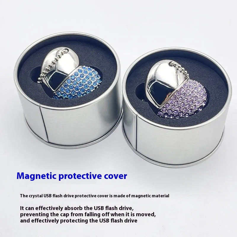 A heart-shaped silver USB flash drive with a brick pattern, shown next to a laptop.