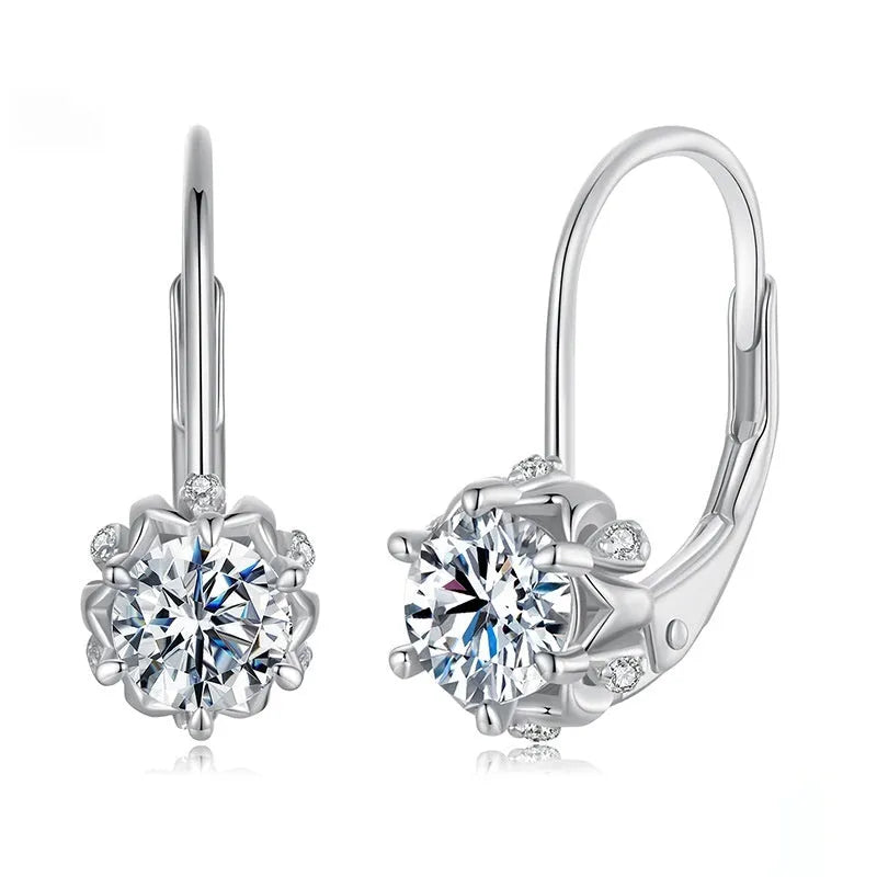 White gold plated sterling silver flower bud ear clip with a moissanite stone.