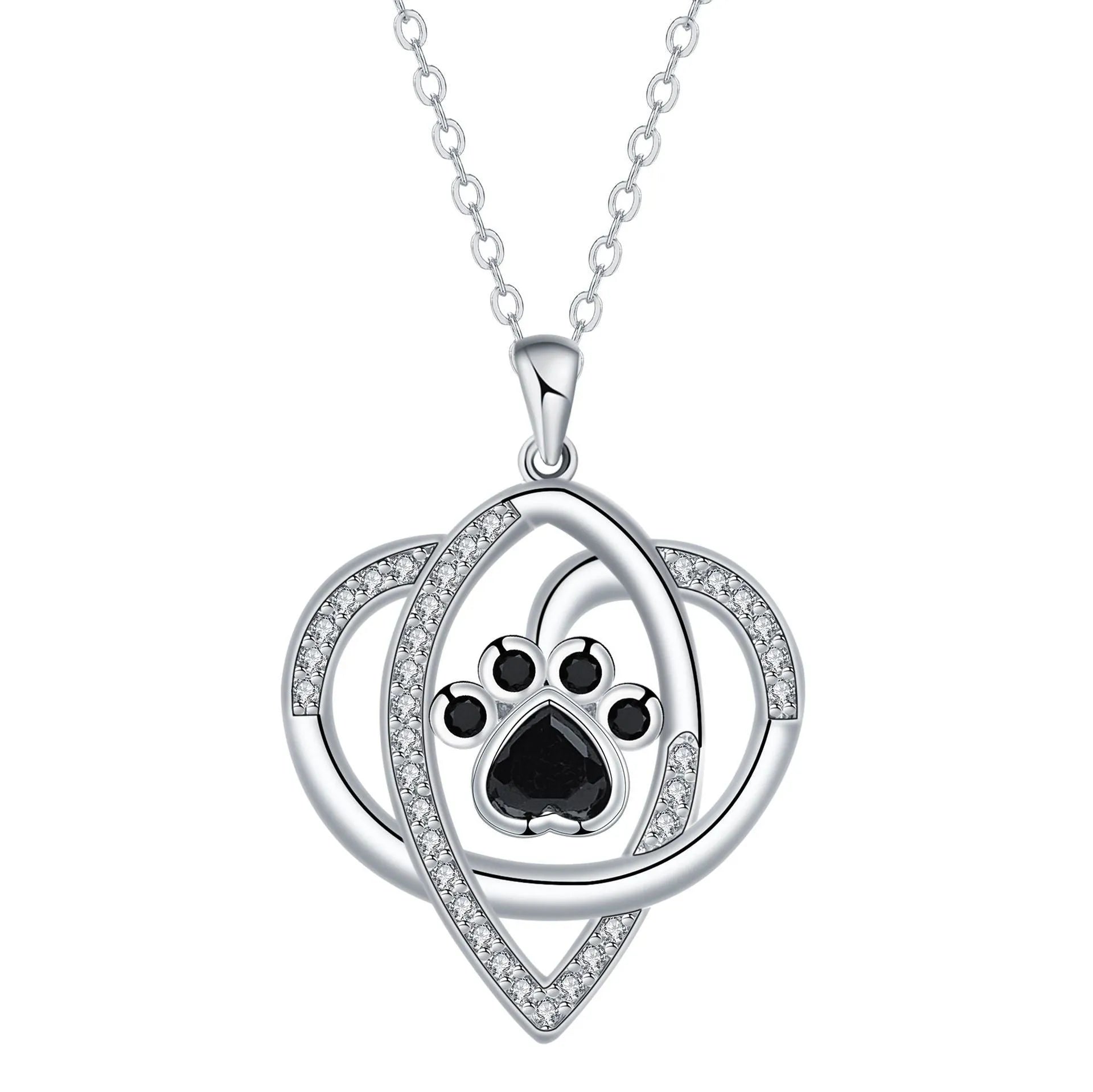 Close-up of a copper necklace pendant showing detailed dog and cat paw prints on a cross chain.