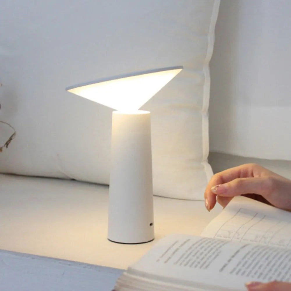 Black and white USB rechargeable LED desk lamp with adjustable head and touch controls.