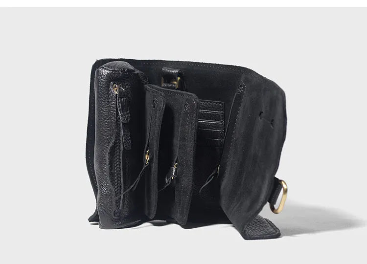 Handmade cow leather vintage wallet in black, showing tape extraction closure, 20cm long.