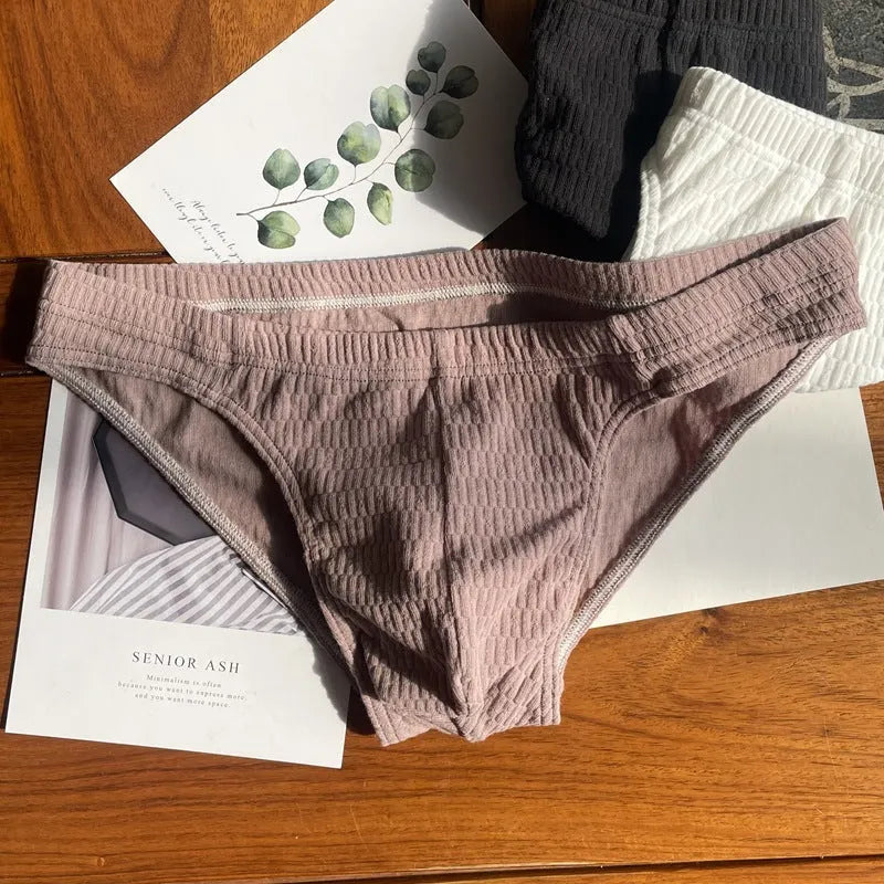 Men's solid colour cotton triangle underwear briefs with mid waistband, shown in apricot black colour.