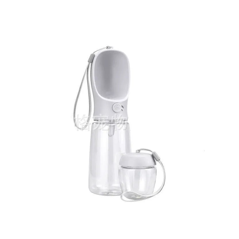 Portable dual-use dog drinking cup showing water dispenser and separate grain bowl compartment